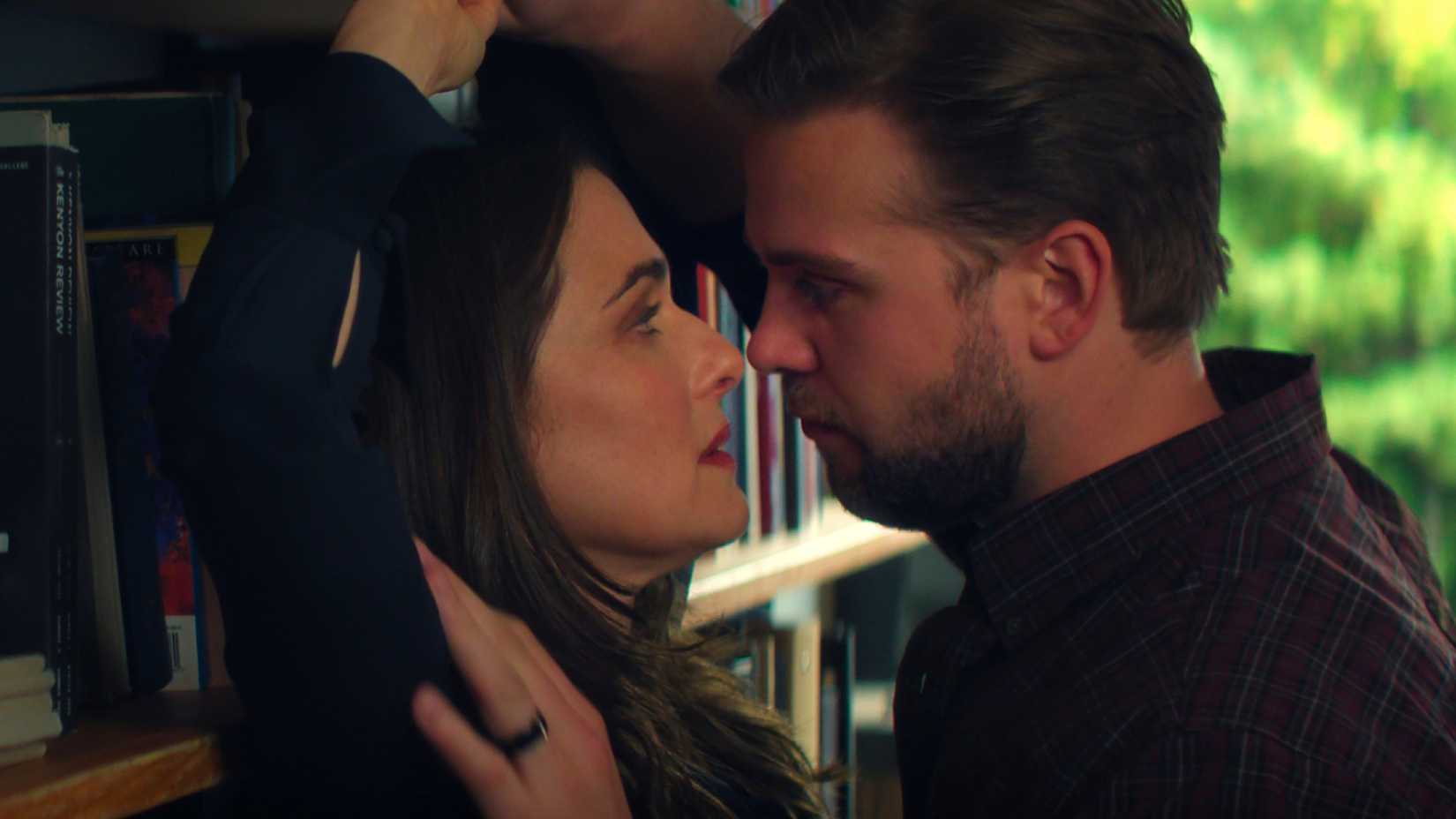 What Happens To M After Her Dangerous Obsession 2 Vladimir pins M against a bookshelf in Netflix's Vladimir