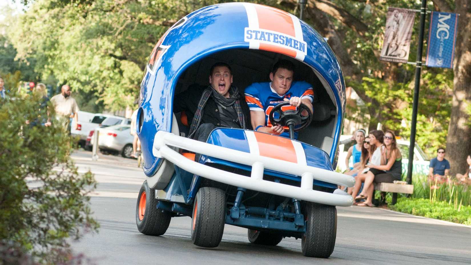 Schmidt (Jonah Hill) and Jenko (Channing Tatum) driving a football cart in 22 Jump Street.