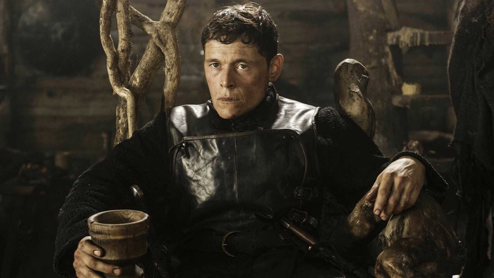 a lord sitting on a wooden throne in game of thrones