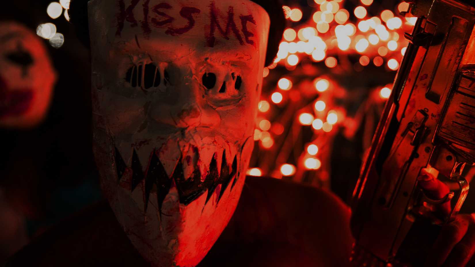 A masked man in The Purge: Anarchy.