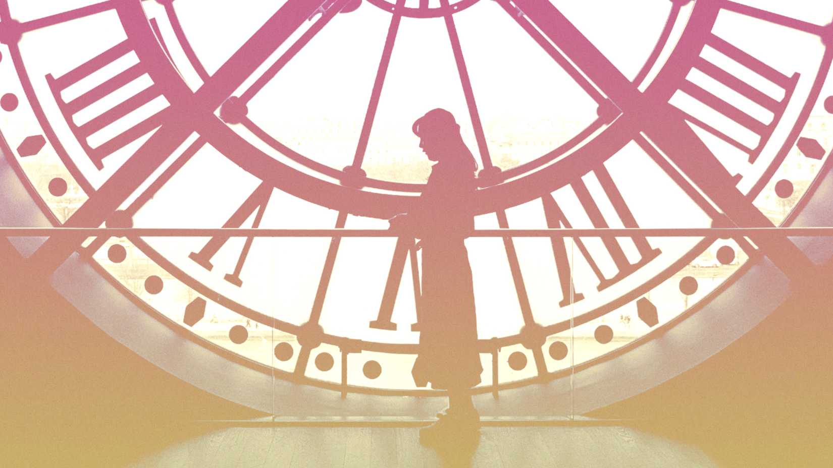 Upcoming Time Travel Show Based On Bestselling Book Will Be Perfect For Outlander Fans 2 A woman stands in front of a large pink and yellow clock