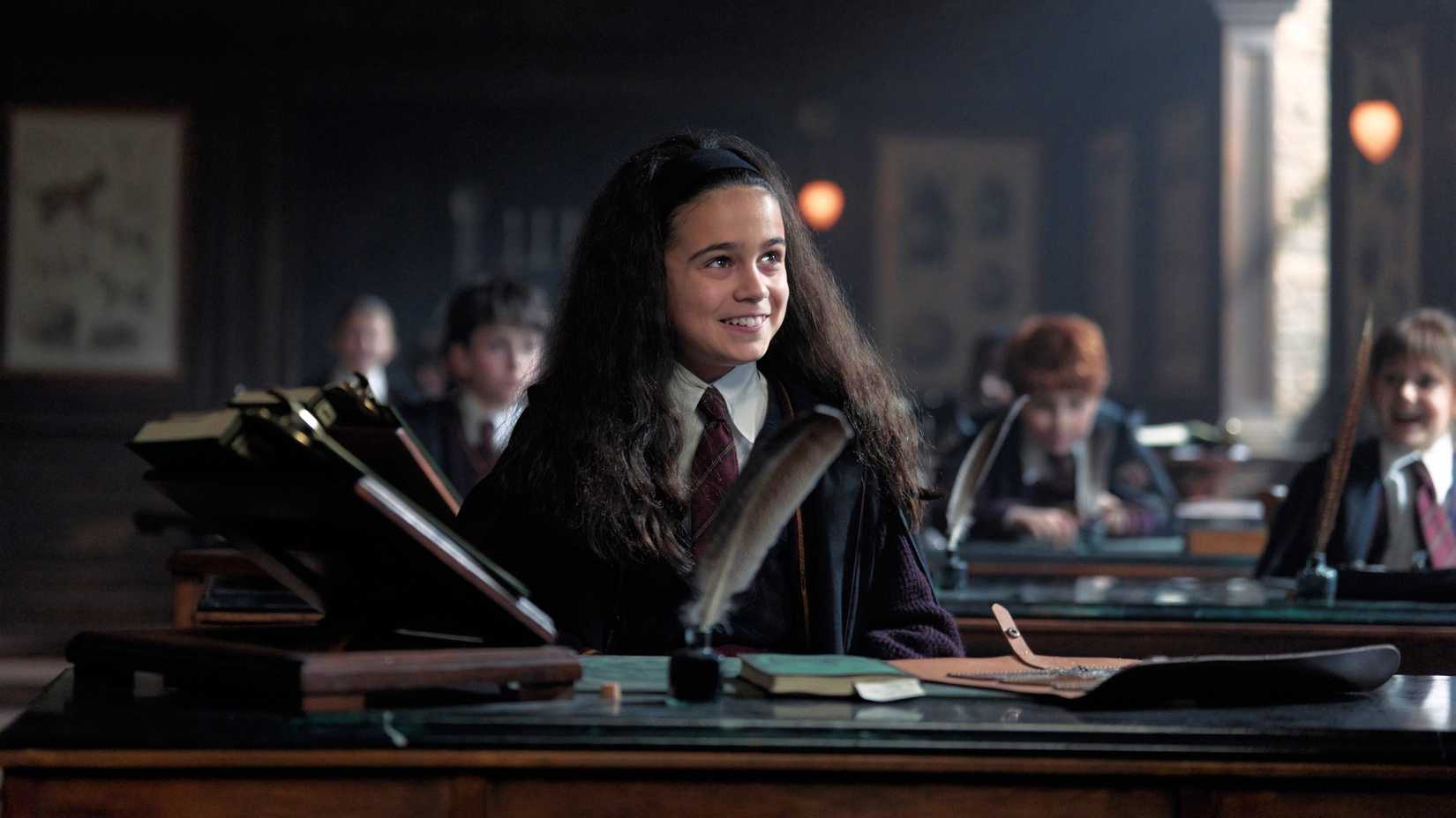 Cast, Trailer, Updates & Everything We Know 3 Arabella Staunton smiling as Hermione Granger in Harry Potter and the Philosopher's Stone