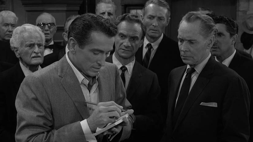 Twilight Zone Episodes With Breathtaking Twists, Surprises, And Themes 2 Archie (Franchot Tone) writing something for Tennyson (Liam Sullivan) in The Twilight Zone episode, The Silence.