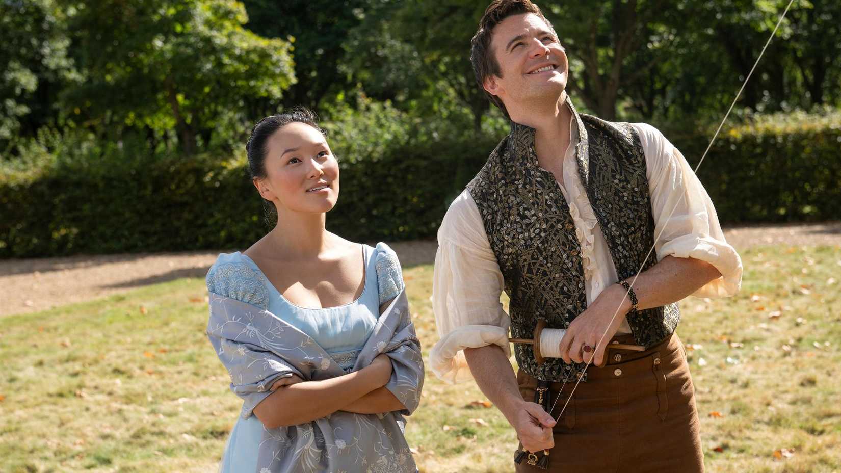 Sophie and Benedict smiling as they play with a kite
