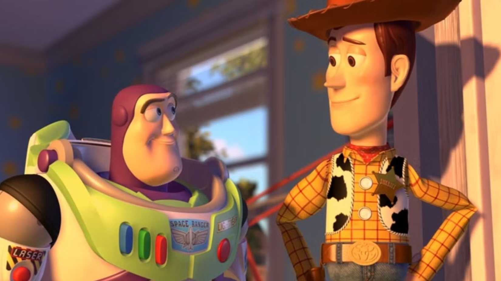 Buzz and Woody smiling at each other in Toy Story 2's ending