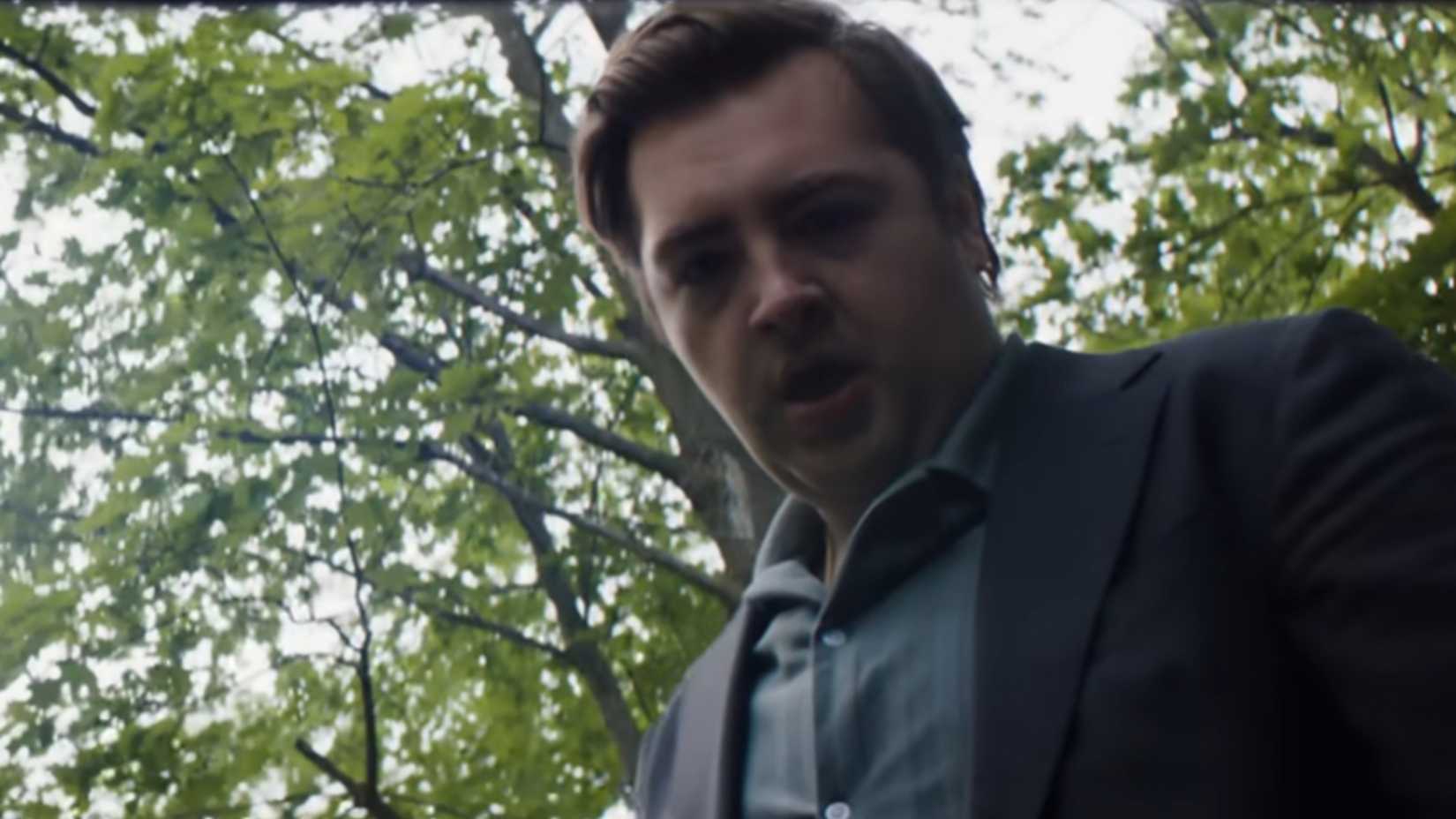 Daniel Blake looking into a trunk, shocked, in Daredevil Born Again season 2