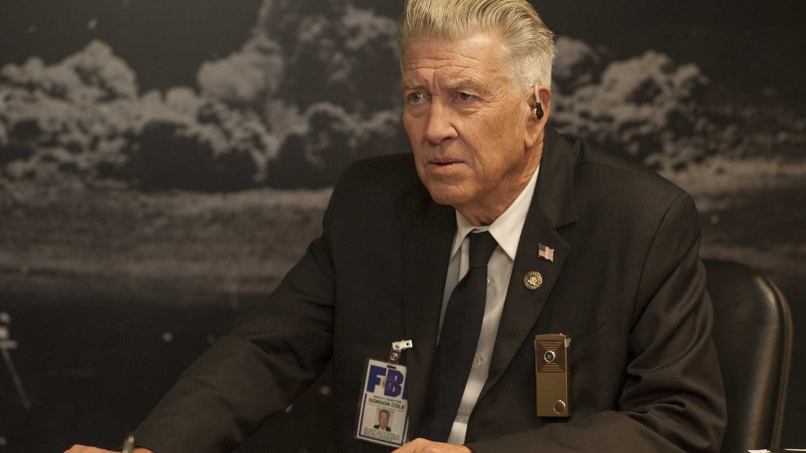 David Lynch in Twin Peaks sitting at a desk.
