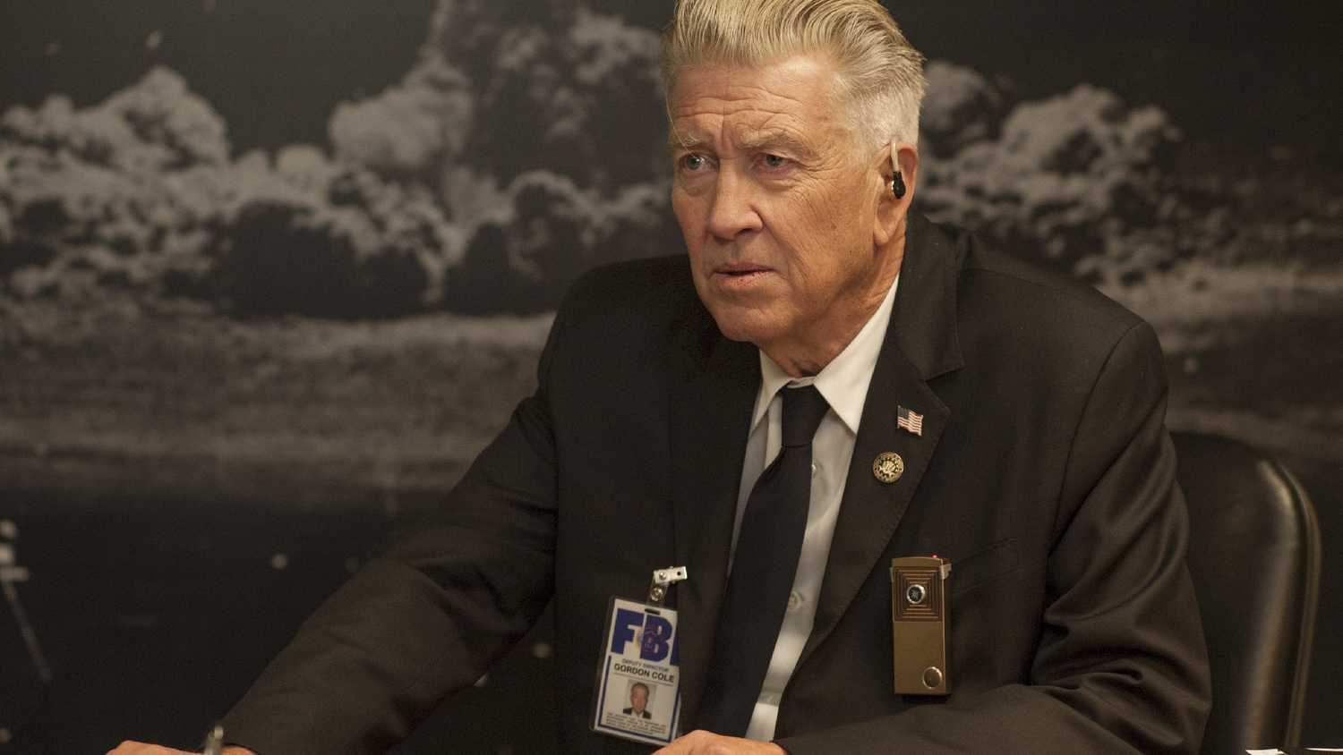 David Lynch in Twin Peaks sitting at a desk.