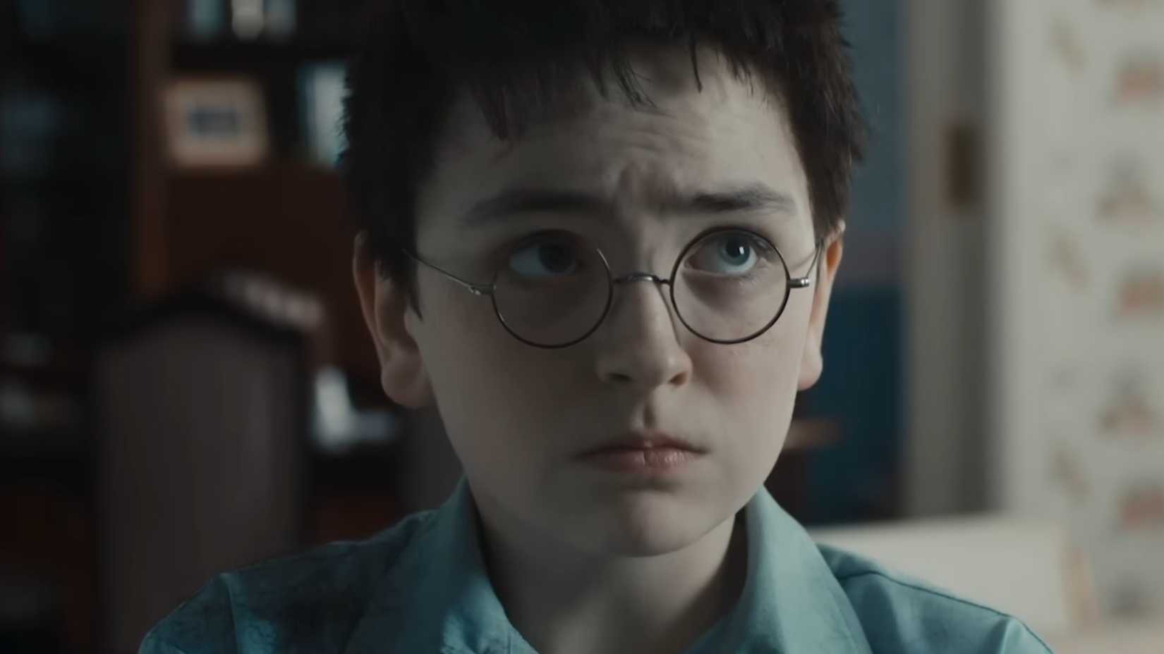 dominic mclaughlin as harry potter looking sad and scared in the harry potter trailer