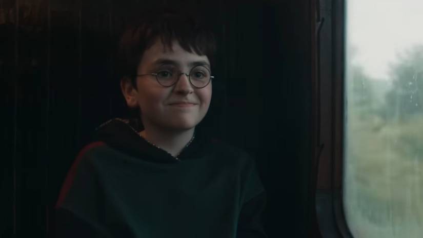 Dominic McLaughlin as Harry Potter smiling in HBO's Harry Potter TV series (2026)
