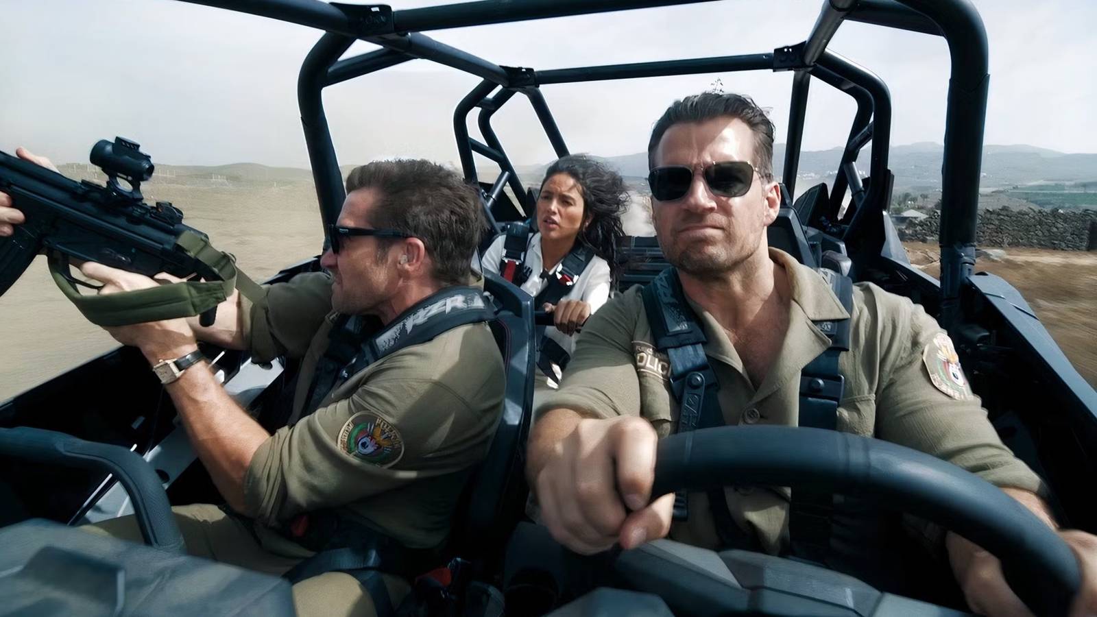 Jake Gyllenhaal & Henry Cavill Are Guns Blazing In First Trailer For Guy Ritchie’s New Action Thriller In The Grey