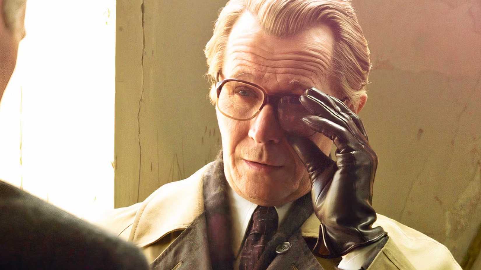 10 Best Non-James Bond Spy Movies, Ranked 3 Gary Oldman tugs his glasses in a tense scene from Tinker Tailor Soldier Spy