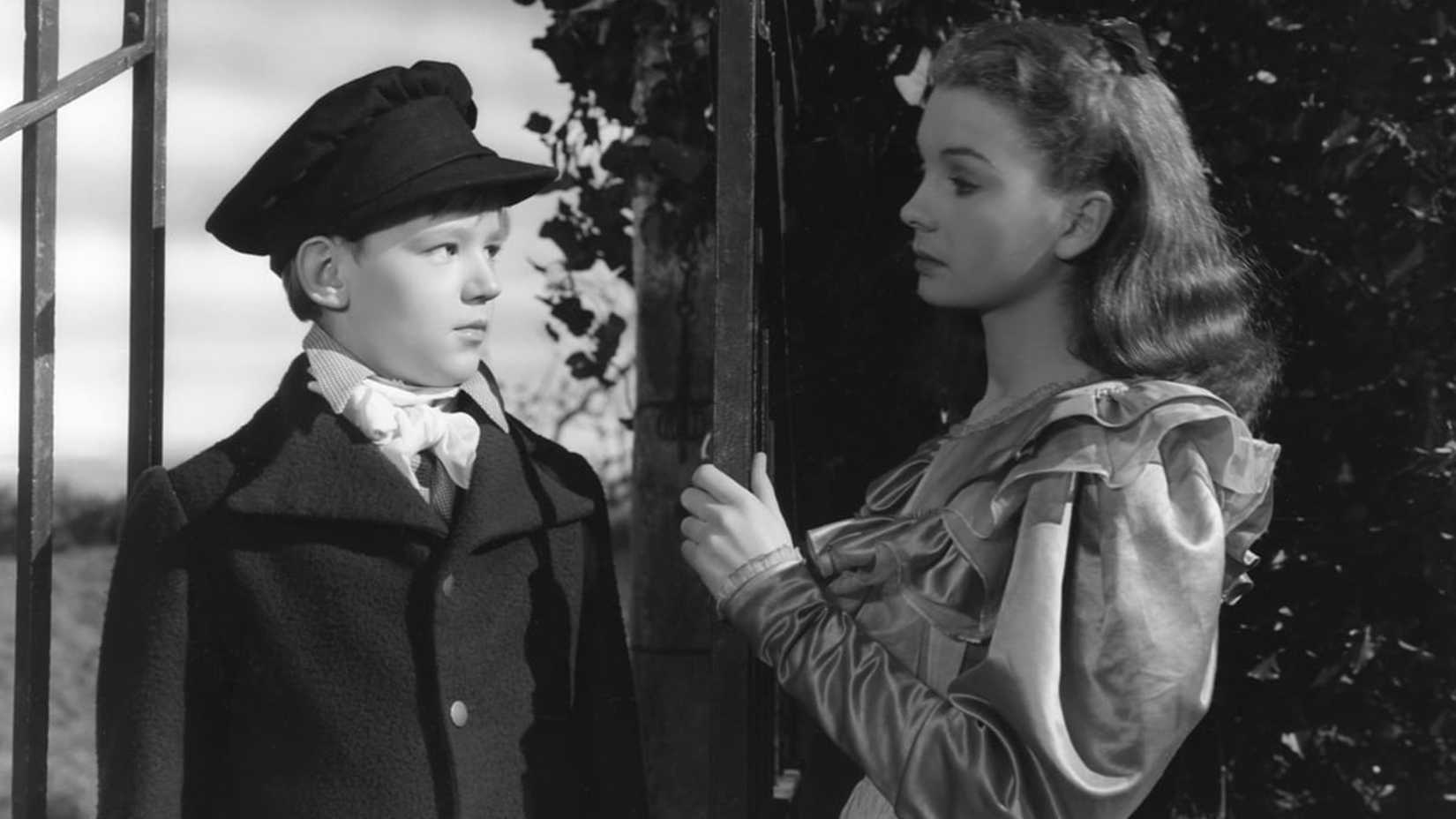 Estella and Pip look at each other in Great Expectations