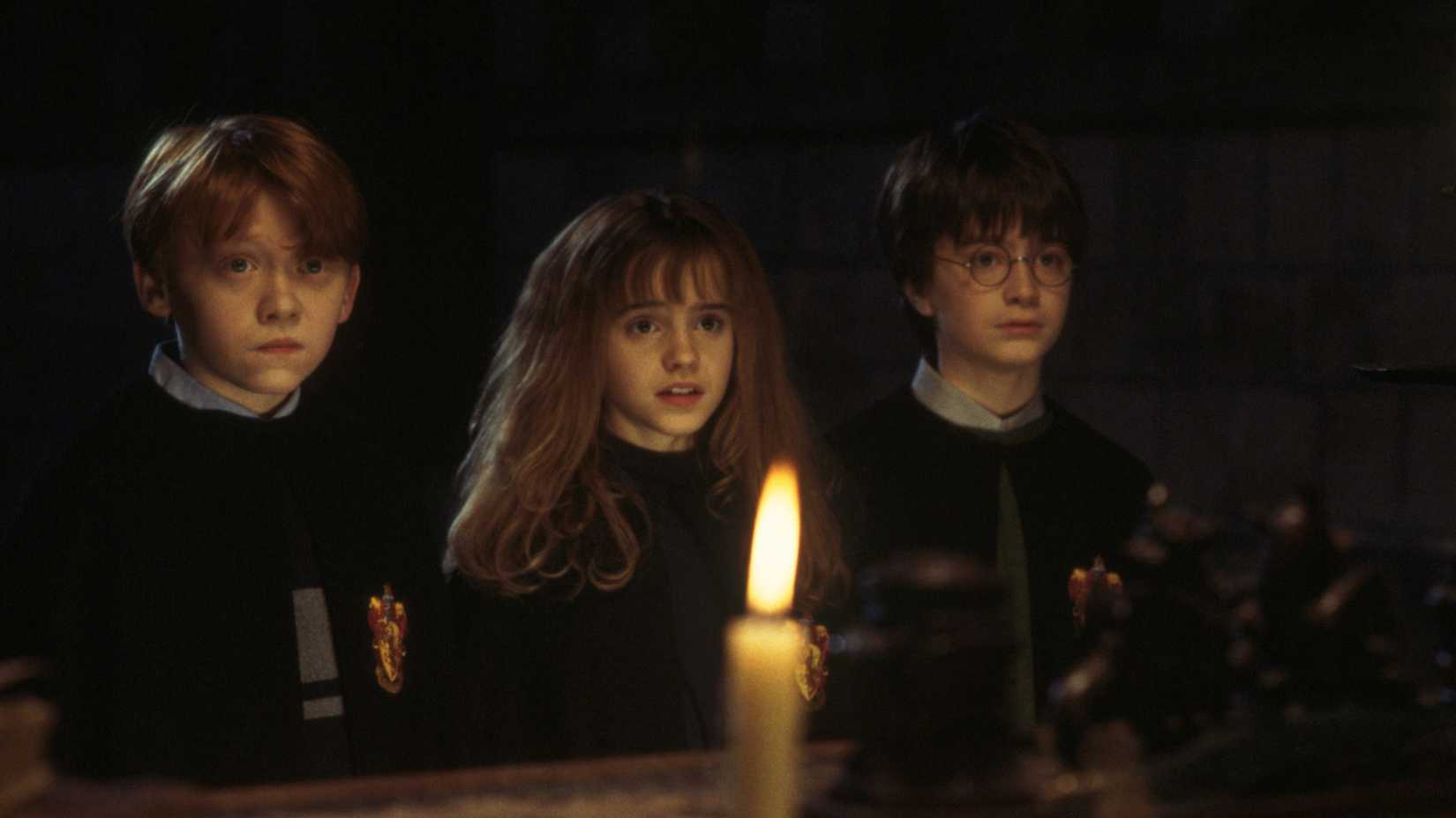 Rupert Grint as Ron Weasley, Emma Watson as Hermione Granger, and Daniel Radcliffe as Harry Potter in Harry Potter and the Sorcerer's Stone
