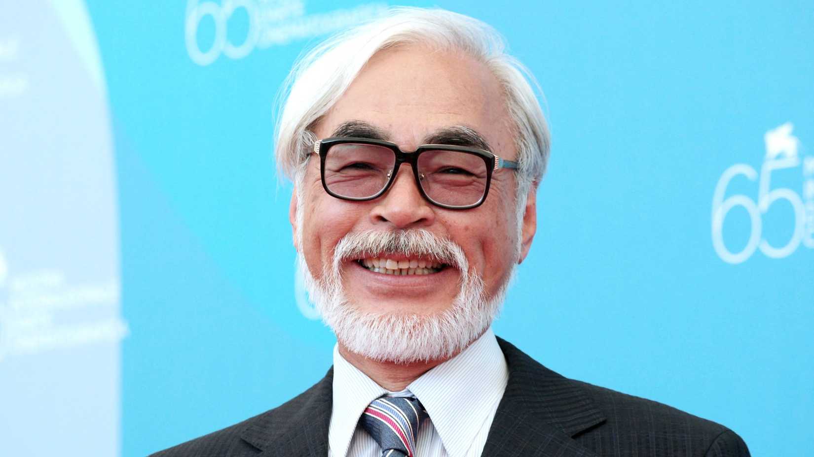 Hayao Miyazaki smiles on the red carpet.