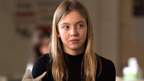 Sydney Sweeney with a half smile in Sharp Objects