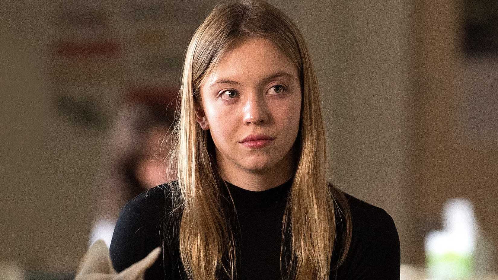 Sydney Sweeney with a half smile in Sharp Objects