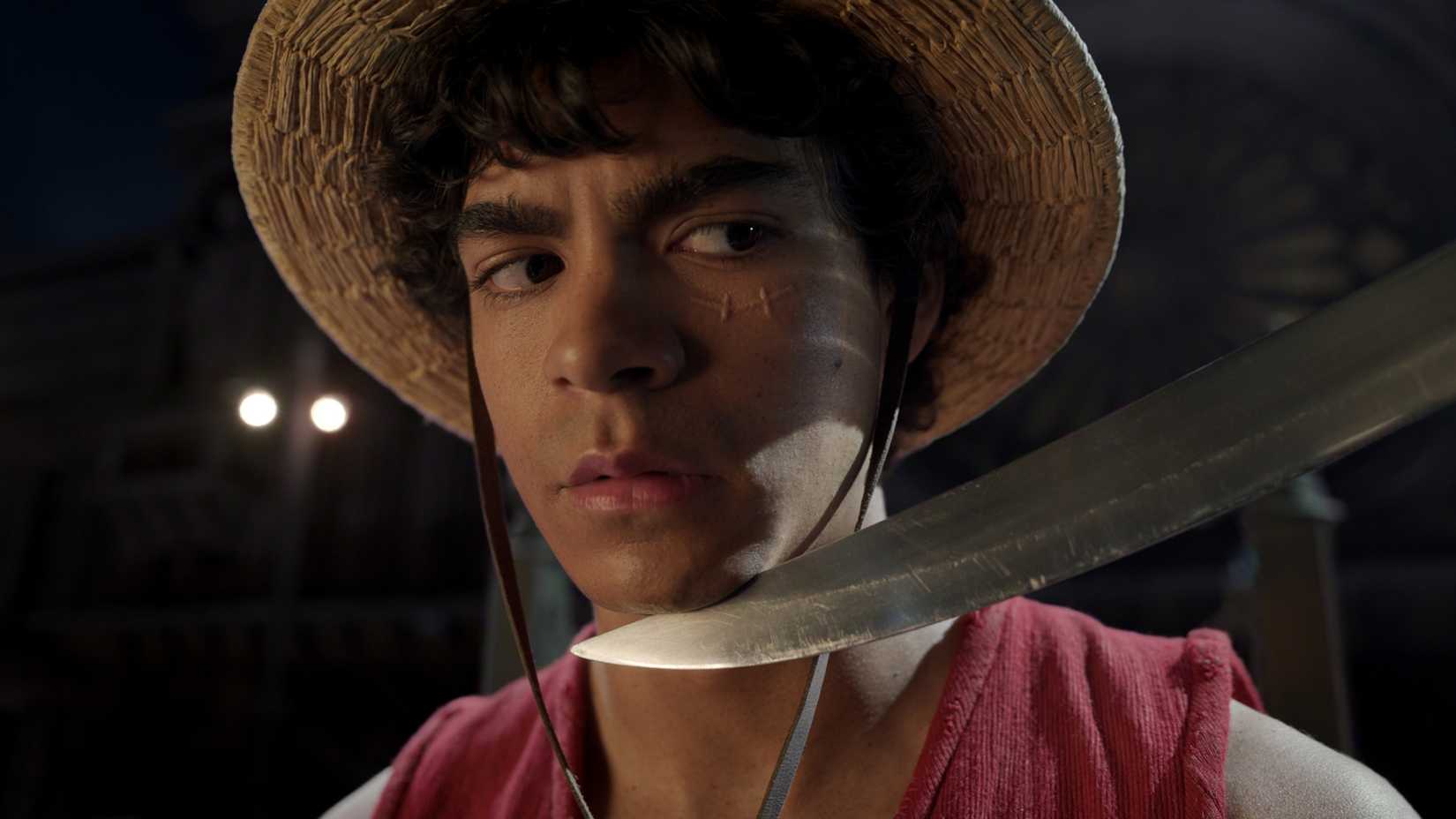 One Piece Season 2's 10 Most Powerful Characters, Ranked 2 Iñaki Godoy as Monkey D. Luffy with a sword to his chin in One Piece season 2