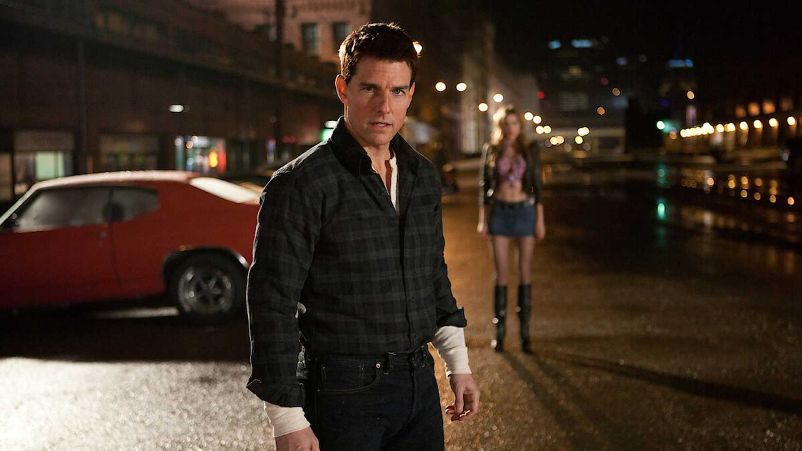 Tom Cruise como Jack Reacher em cena de ação