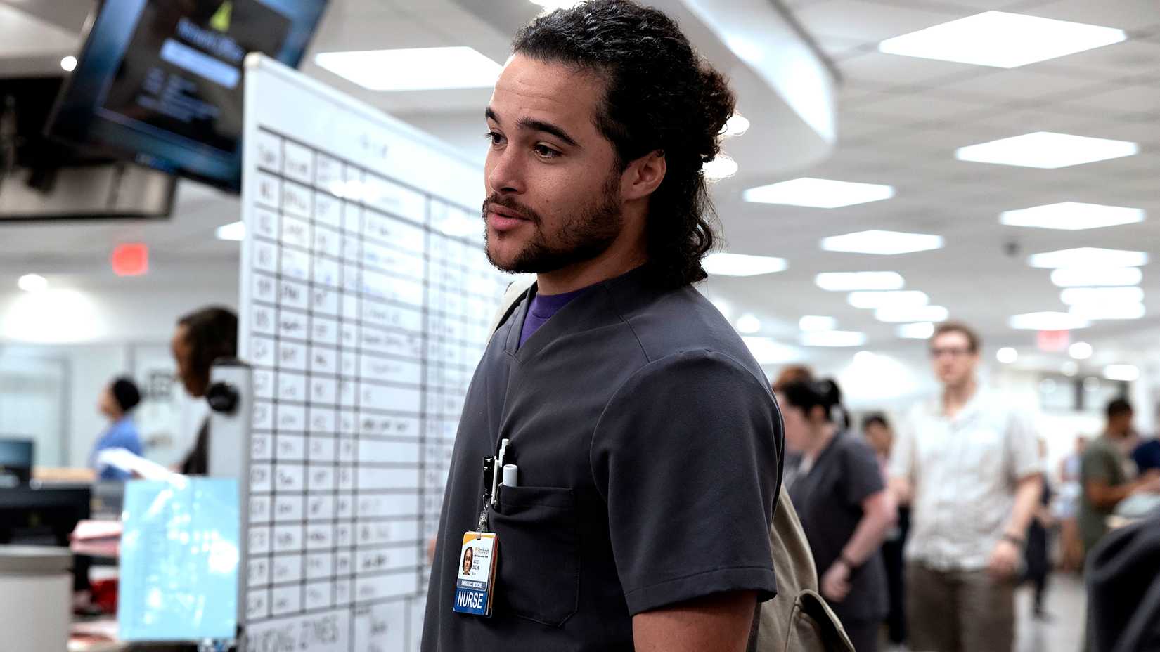 Jalen Thomas Brooks' Mateo looking intently while standing near dry erase board in The Pitt season 2