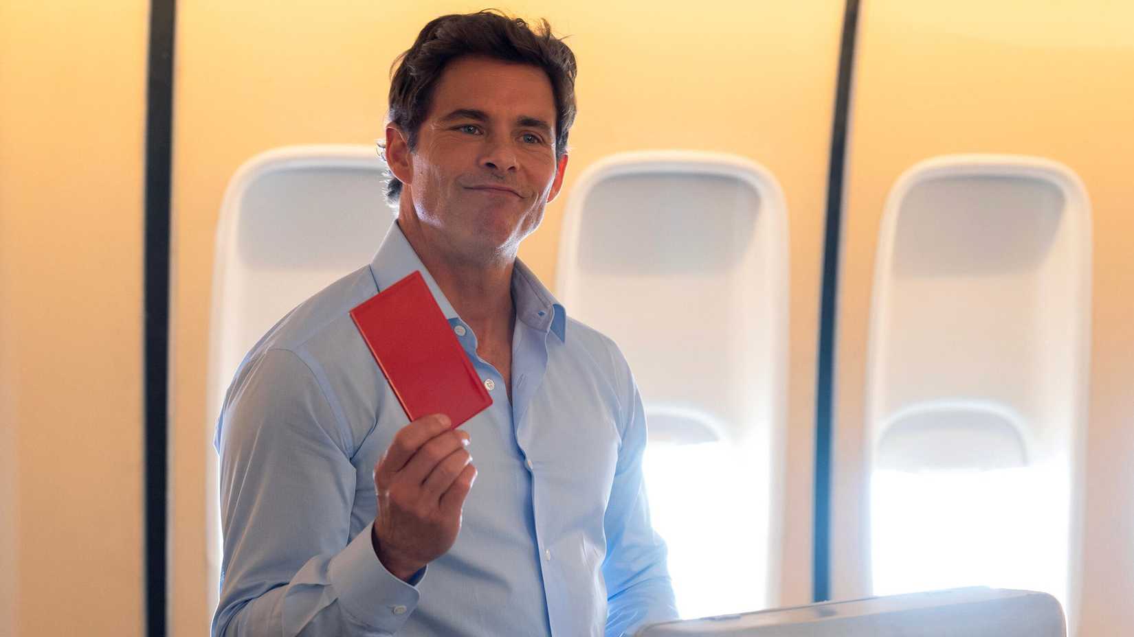 James Marsden as President Cal Bradford holding a red book in Paradise