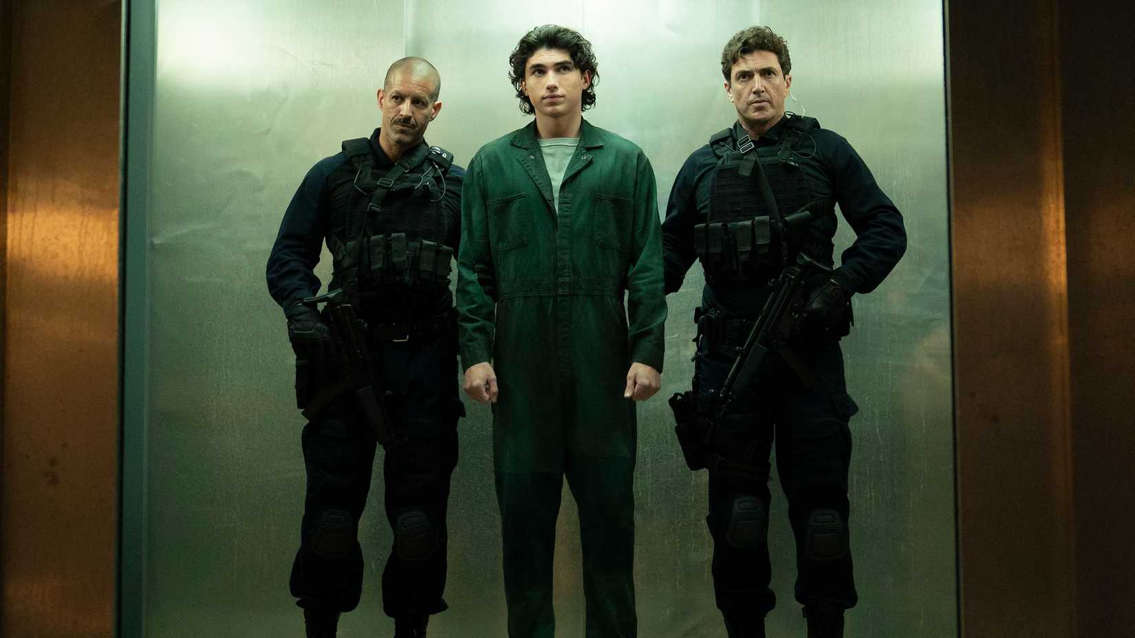 Why Jane Is Really Working For Sinatra 1 Jeremy Bradford (Charlie Evans) being escorted by two guards in Paradise season 2