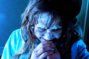 Linda Blair as Regan laughing in The Exorcist