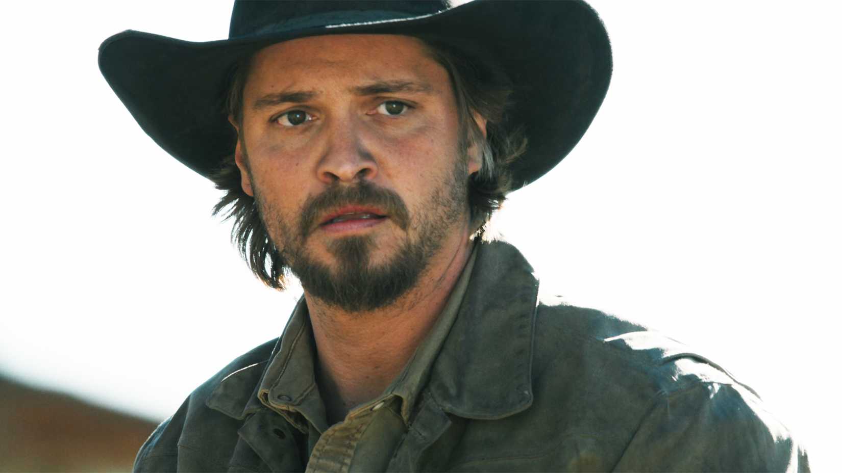 Luke Grimes as Kayce Dutton, staring ahead, in the debut episode of Marshals