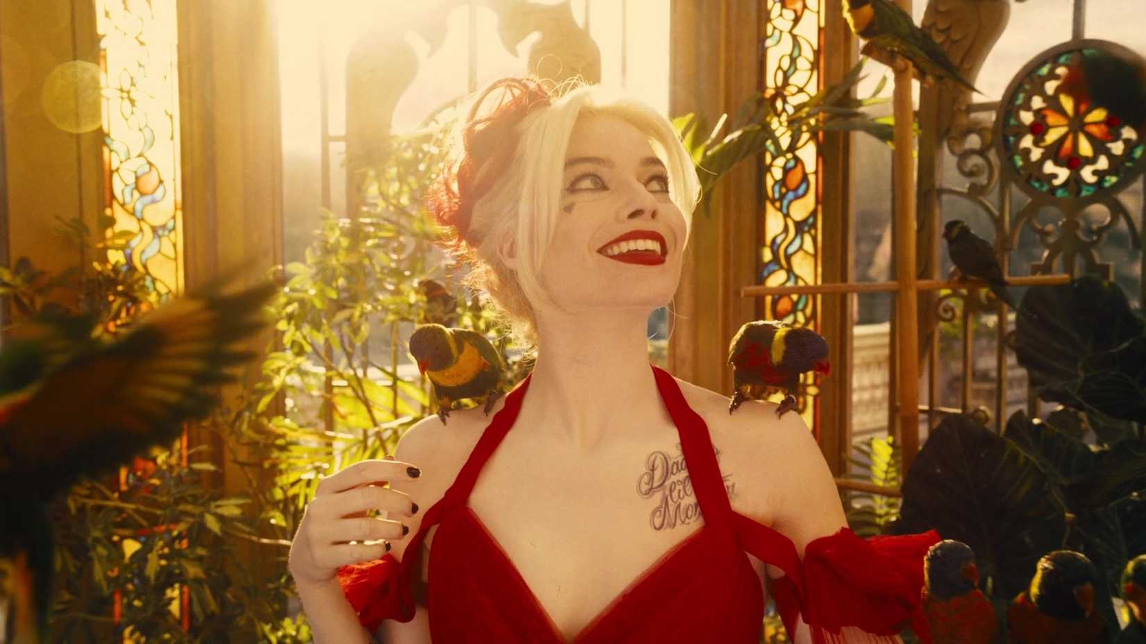 Margot Robbie smiling as Harley Quinn in James Gunn's The Suicide Squad