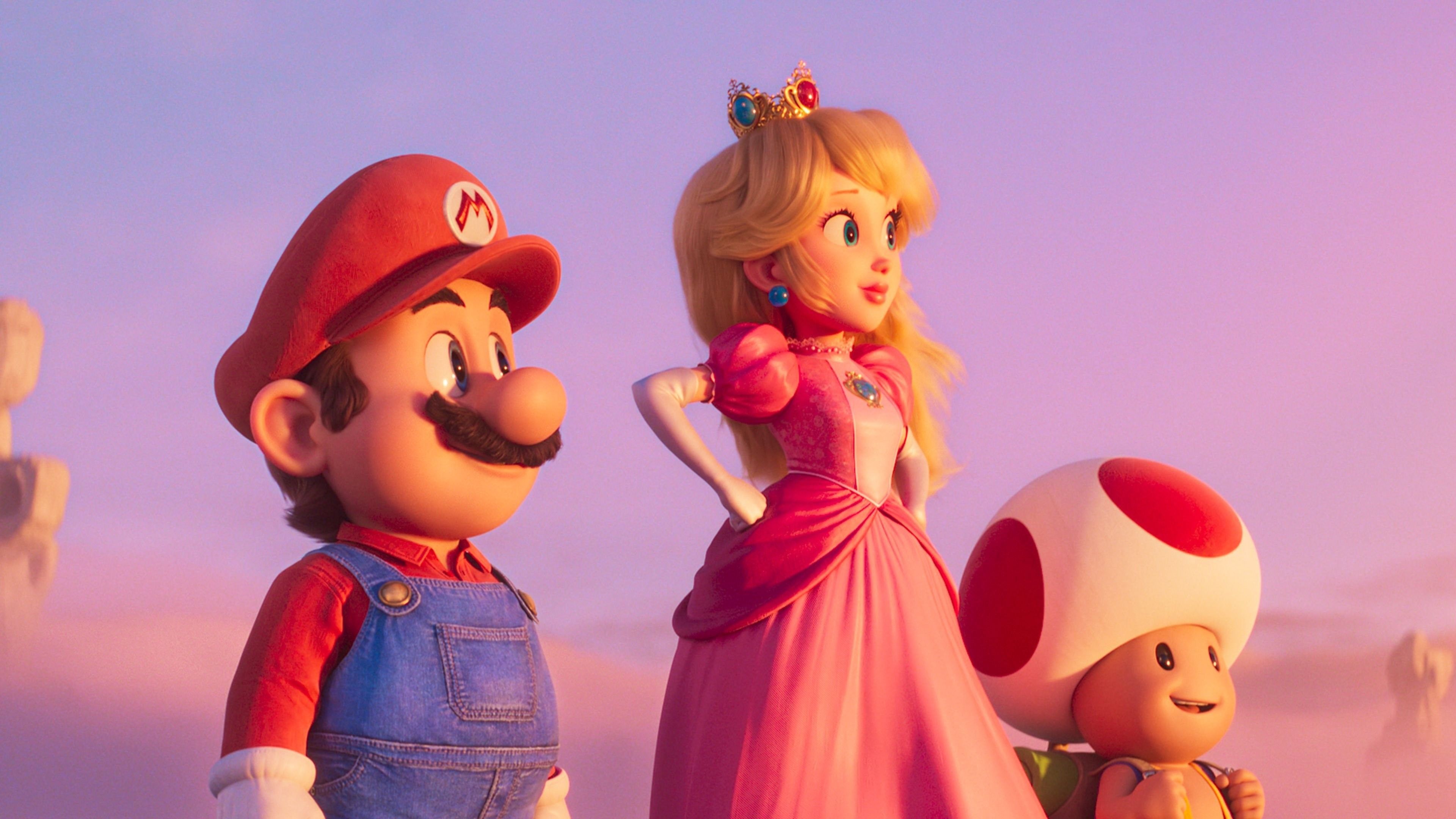 Mario, Princess Peach, and Toad smile and look off camera in The Super Mario Bros. Movie