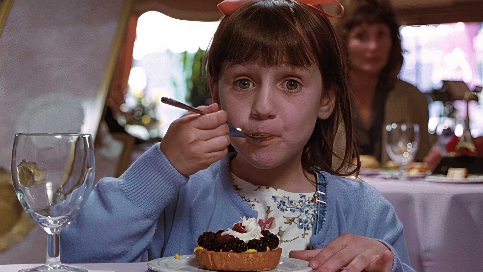 10 Near-Perfect Family Movies That No One Remembers Today 1 Matilda (Mara Wilson) eating cake in a restaurant