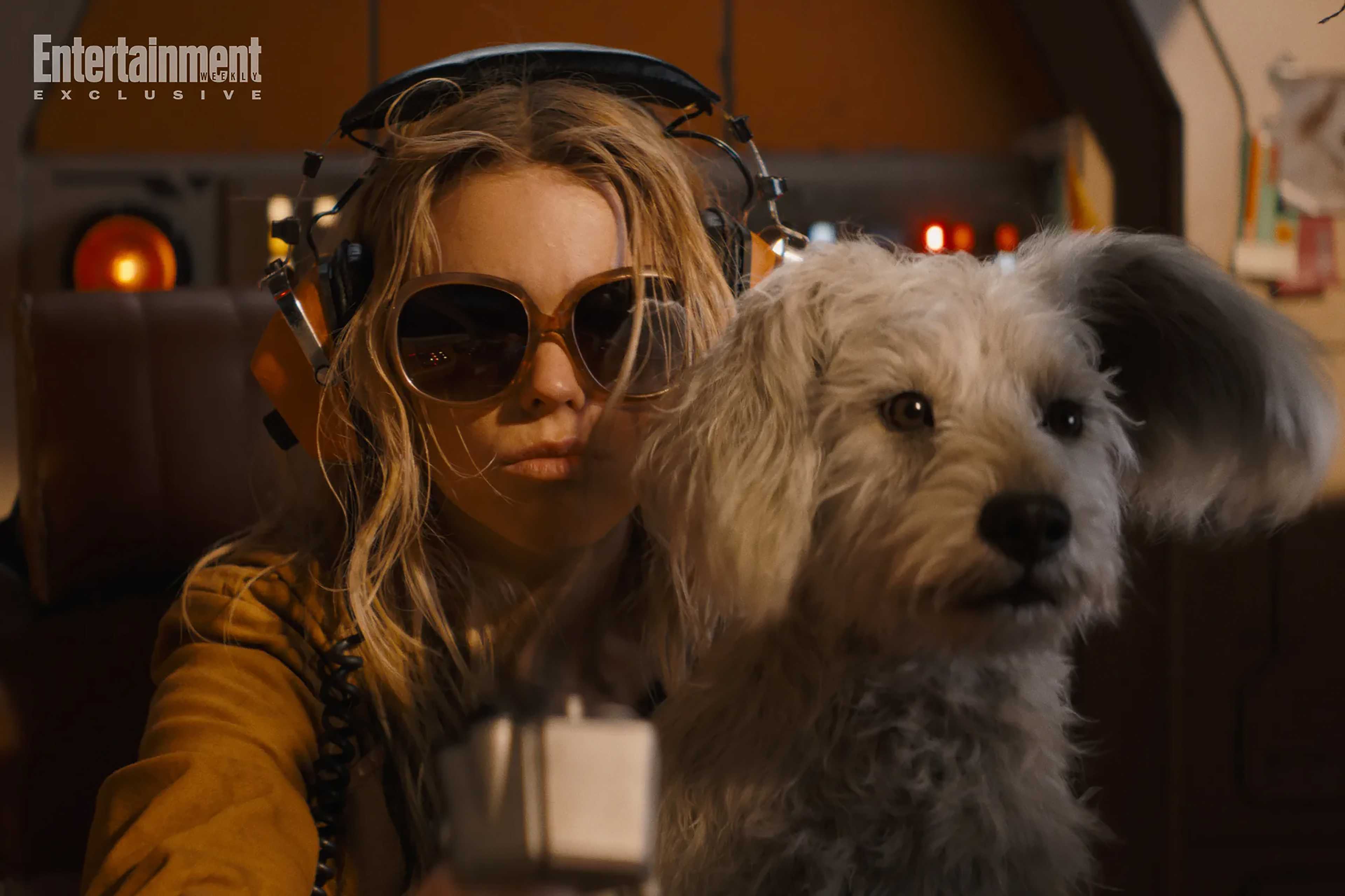 Milly Alcock's Kara sitting with Krypto in her lap in Supegirl