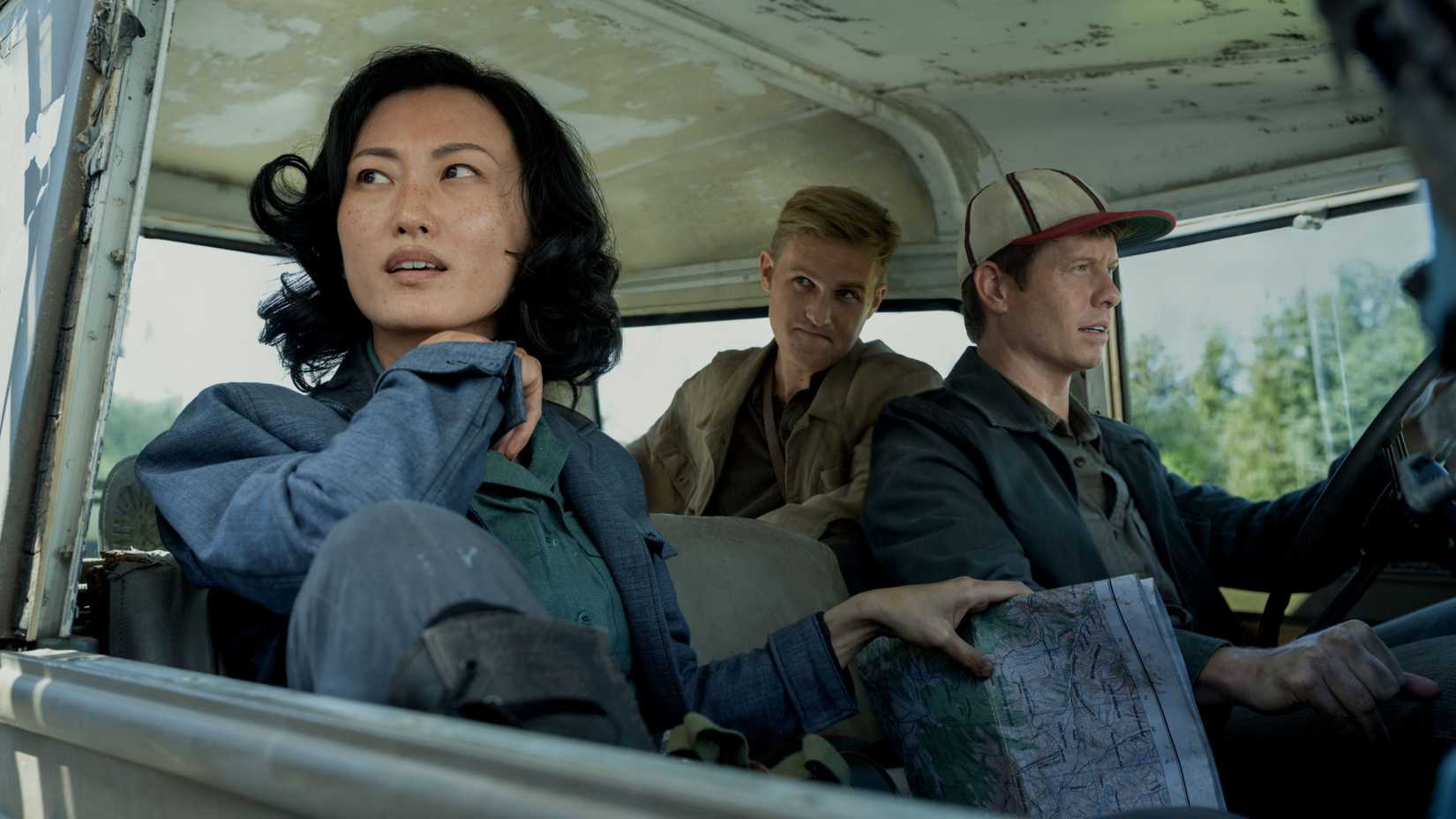 Keiko (Mari Yamamoto), Bill Landa (Anders Holm), and Lee Shaw (Wyatt Russell) in a truck in Monarch: Legacy of Monsters