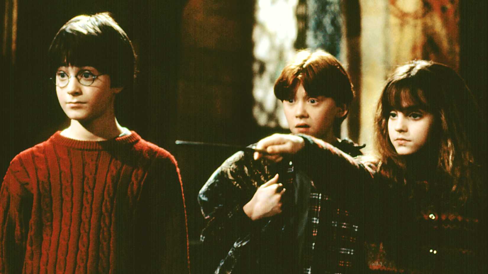 Emma Watson as Hermione Granger, Daniel Radcliffe as Harry Potter, and Rupert Grint as Ron Weasley in Harry Potter and the Sorcerer's Stone