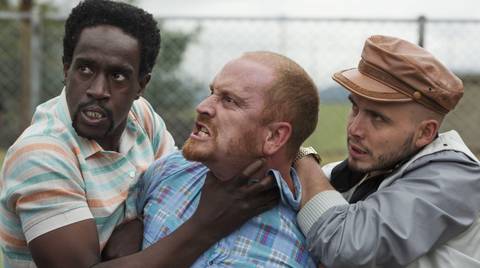 Julian Diaz and Alejandro Buitrago holding Christian Tappán in Narcos (2015)