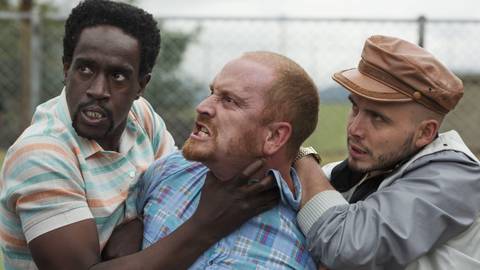 Julian Diaz and Alejandro Buitrago holding Christian Tappán in Narcos (2015)