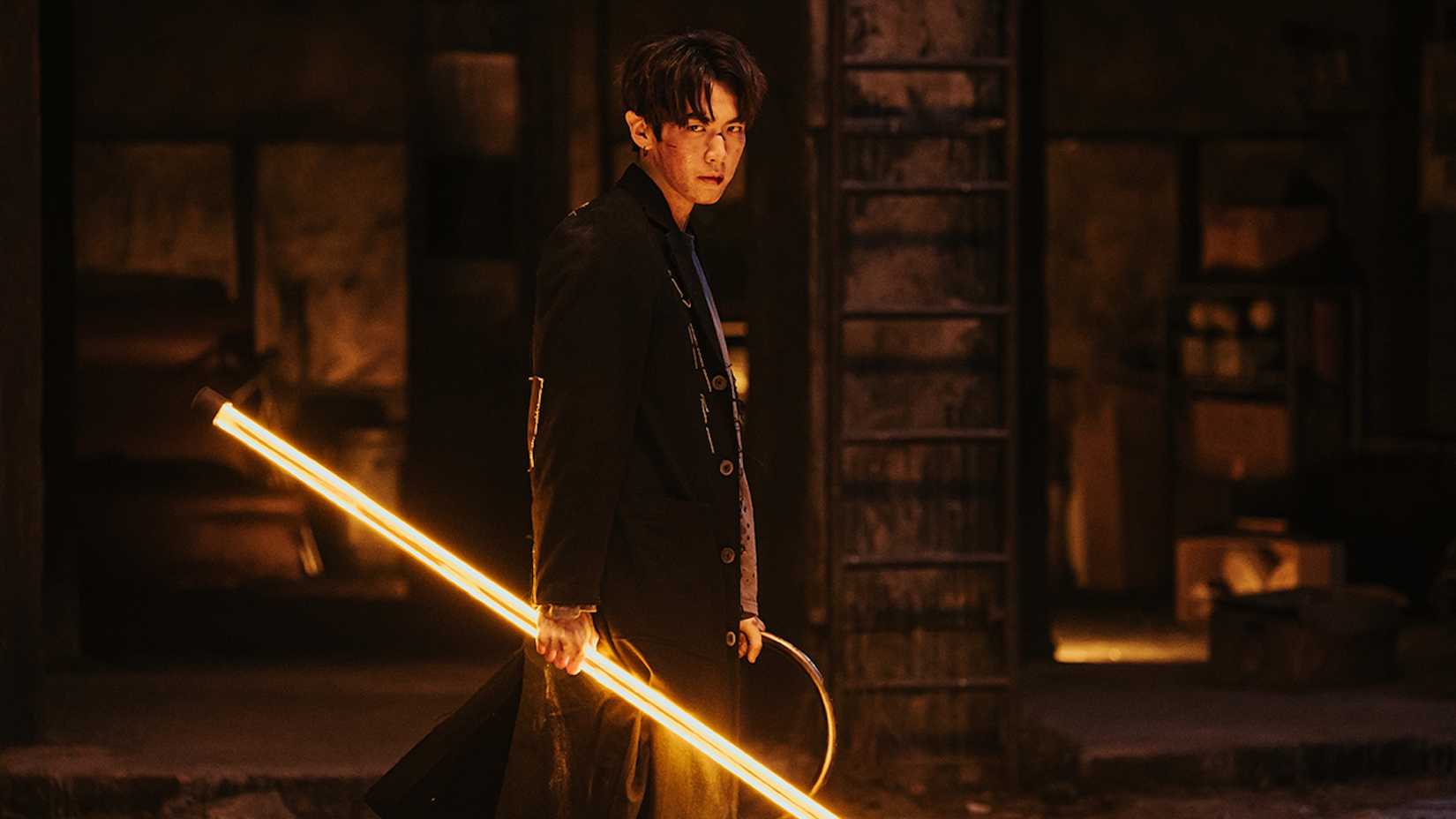 12 Upcoming Netflix Shows You Cannot Miss 2 A man holding a light stick in Netflix's Agent from Above.