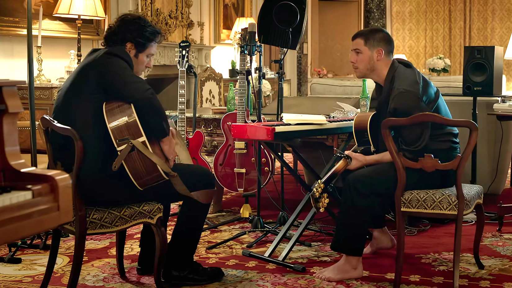 Paul Rudd & Nick Jonas' New 100% RT Comedy Will Continue A 19-Year Tradition, Says Power Ballad Director 1 Paul Rudd's Rick and Nick Jonas' Danny sitting next to each other with guitars in a recording space in Power Ballad