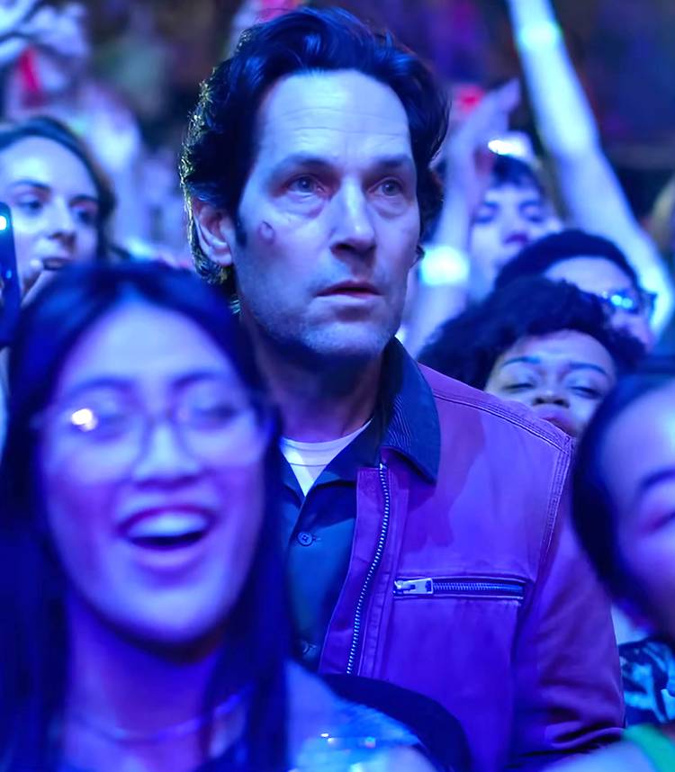 Paul Rudd's Rick staring intently while in a concert crowd in Power Ballad Vertical