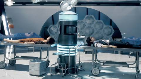 People lying in gurneys in Firefly's ship
