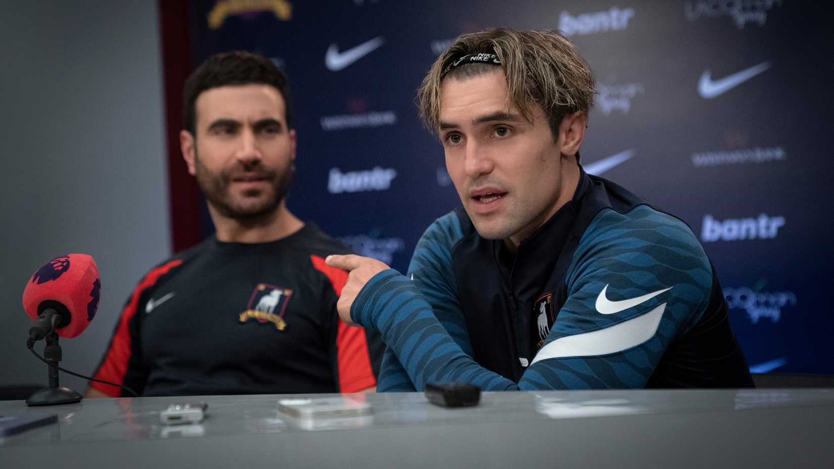 Ted Lasso Season 4 Will Be The Apple TV Show's Biggest Test Yet 1 Phil Dunster's Jamie pointing towards Brett Goldstein's Roy during a press conference in Ted Lasso season 3