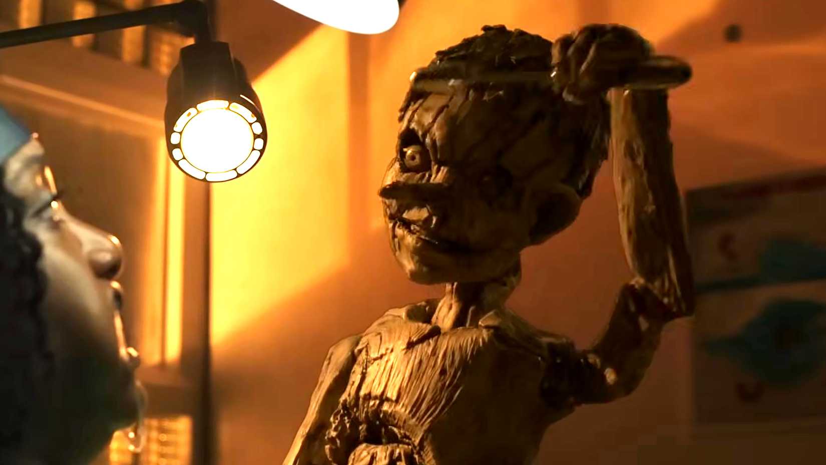 Pinocchio holding an electric drill above his head in Pinocchio Unstrung