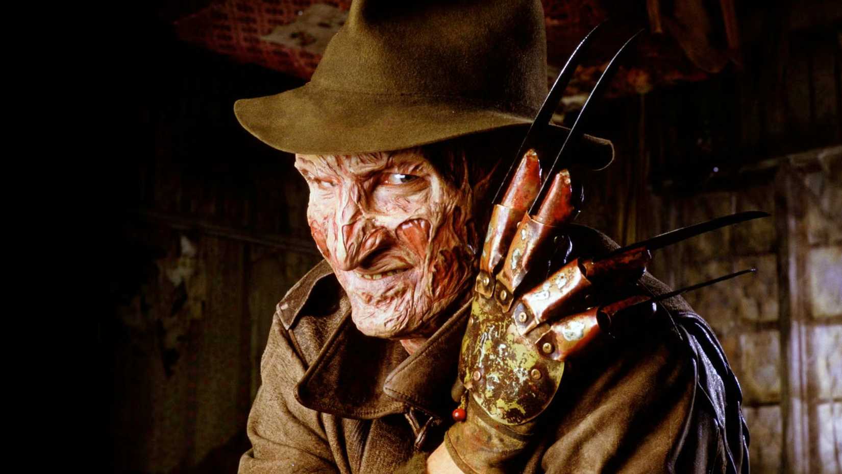 Robert Englund as Freddy Krueger with his claw and hat in A Nightmare on Elm Street