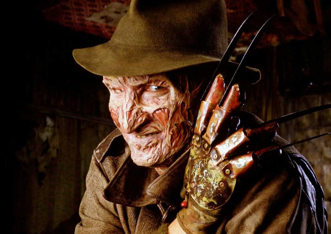Robert Englund as Freddy Krueger with his claw and hat in A Nightmare on Elm Street