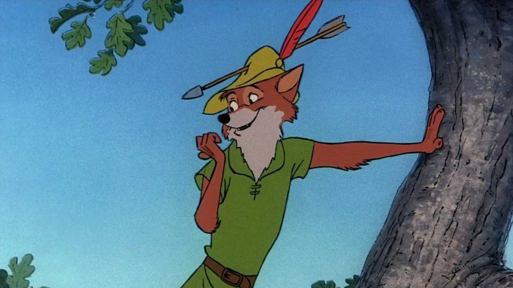 10 Disney Animated Movies Impossible To Adapt In Live-Action 5 Robin Hood leans against a tree in the Disney movie