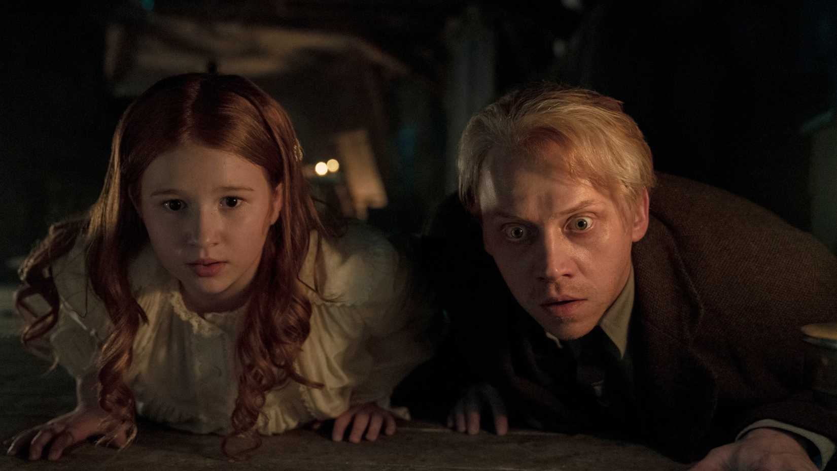 rupert grint and a child in guillermo del toro s cabinet of curiosities