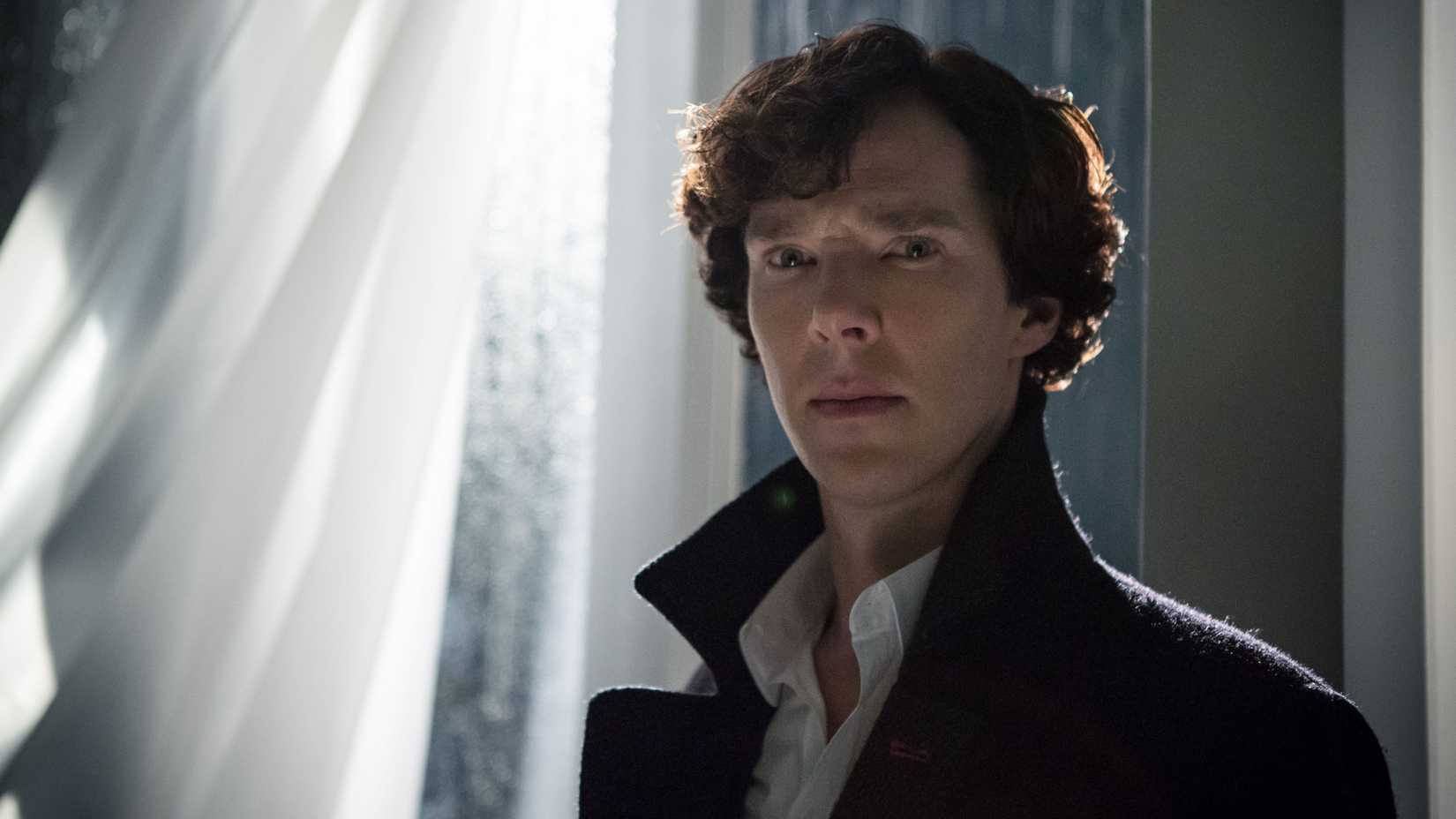 Sherlock still featuring Benedict Cumberbatch as Sherlock Holmes in front of a window.