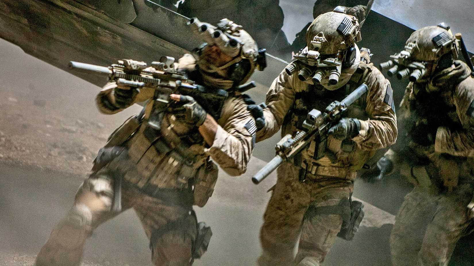 10 Best Non-James Bond Spy Movies, Ranked 1 Soldiers in Zero Dark Thirty hold weapons while rushing in the desert