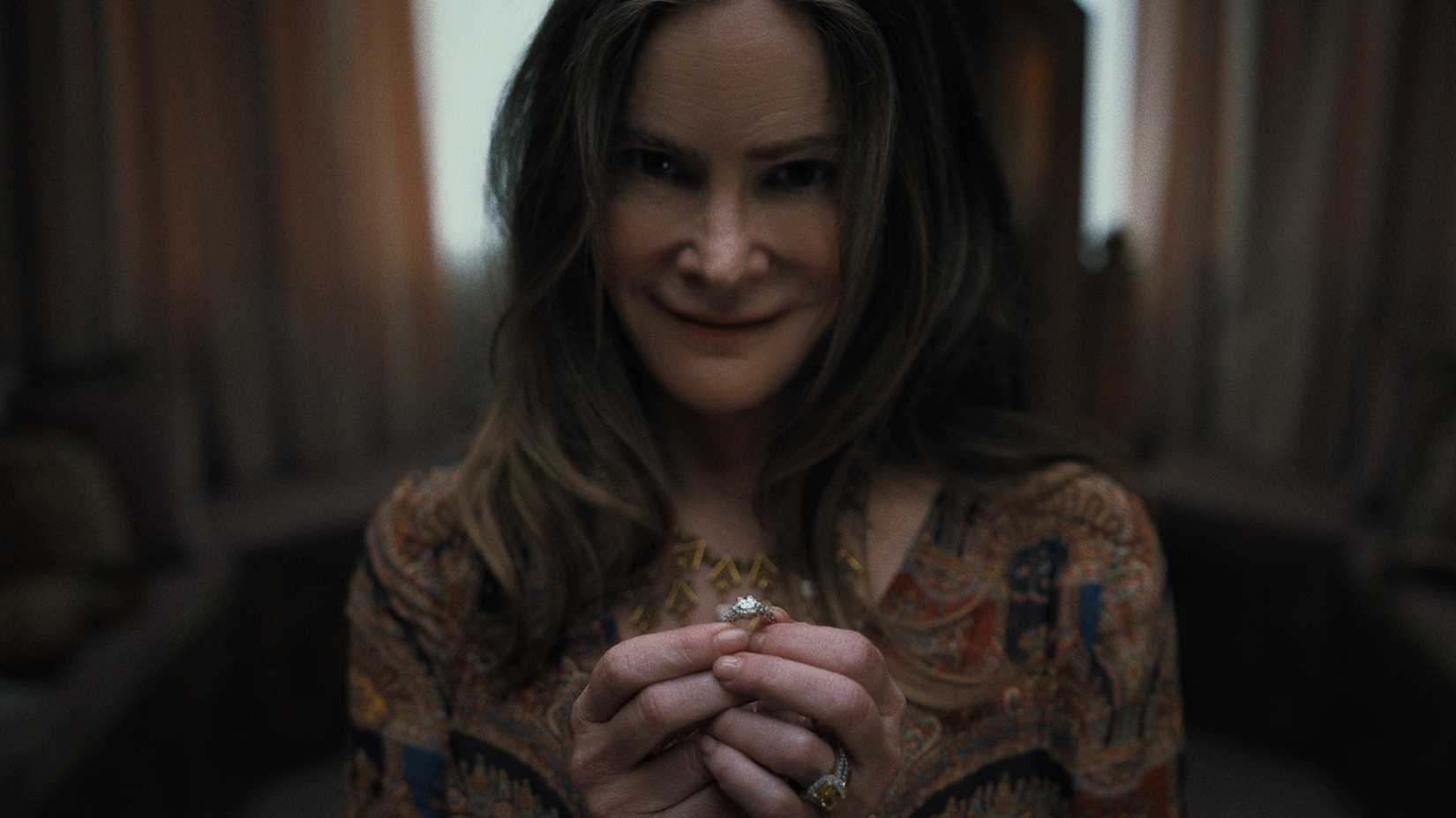 Victoria smiles creepily while holding an engagement ring in Something Very Bad Is Going to Happen episode 2