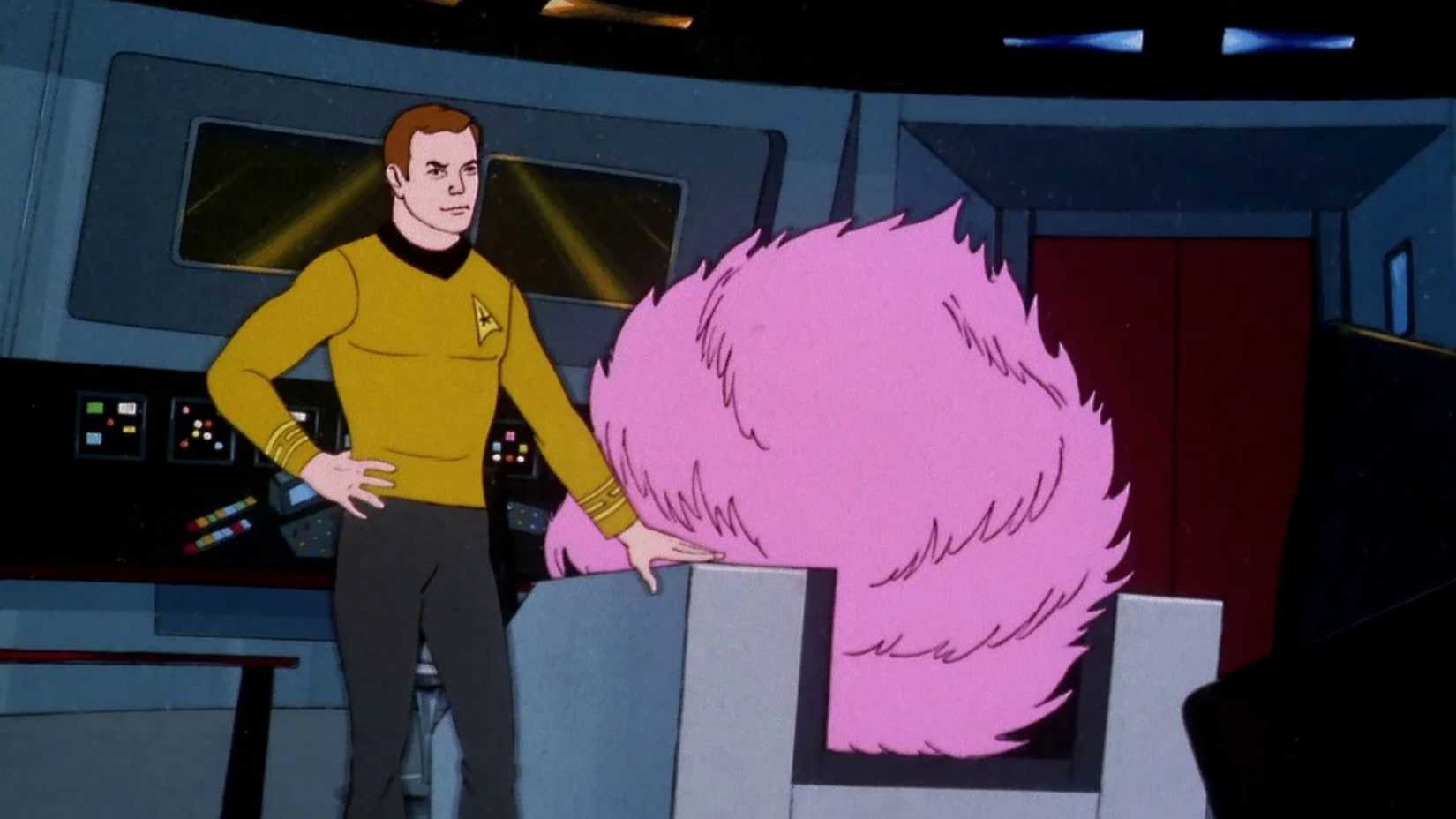 Kirk looks at a giant tribble in his chair in Star Trek The Animated Series